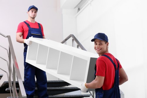 Professional movers carrying furniture during a Croydon relocation