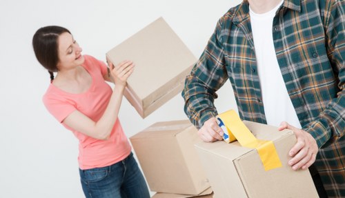 Customer moving storage items safely inside a clean self storage facility