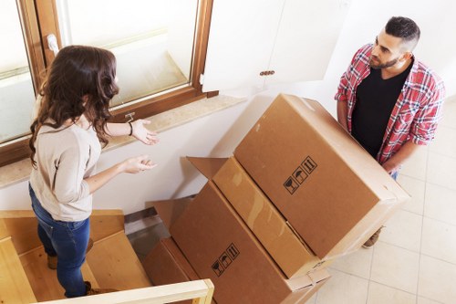 Careful loading of household items by a man and van team in Croydon